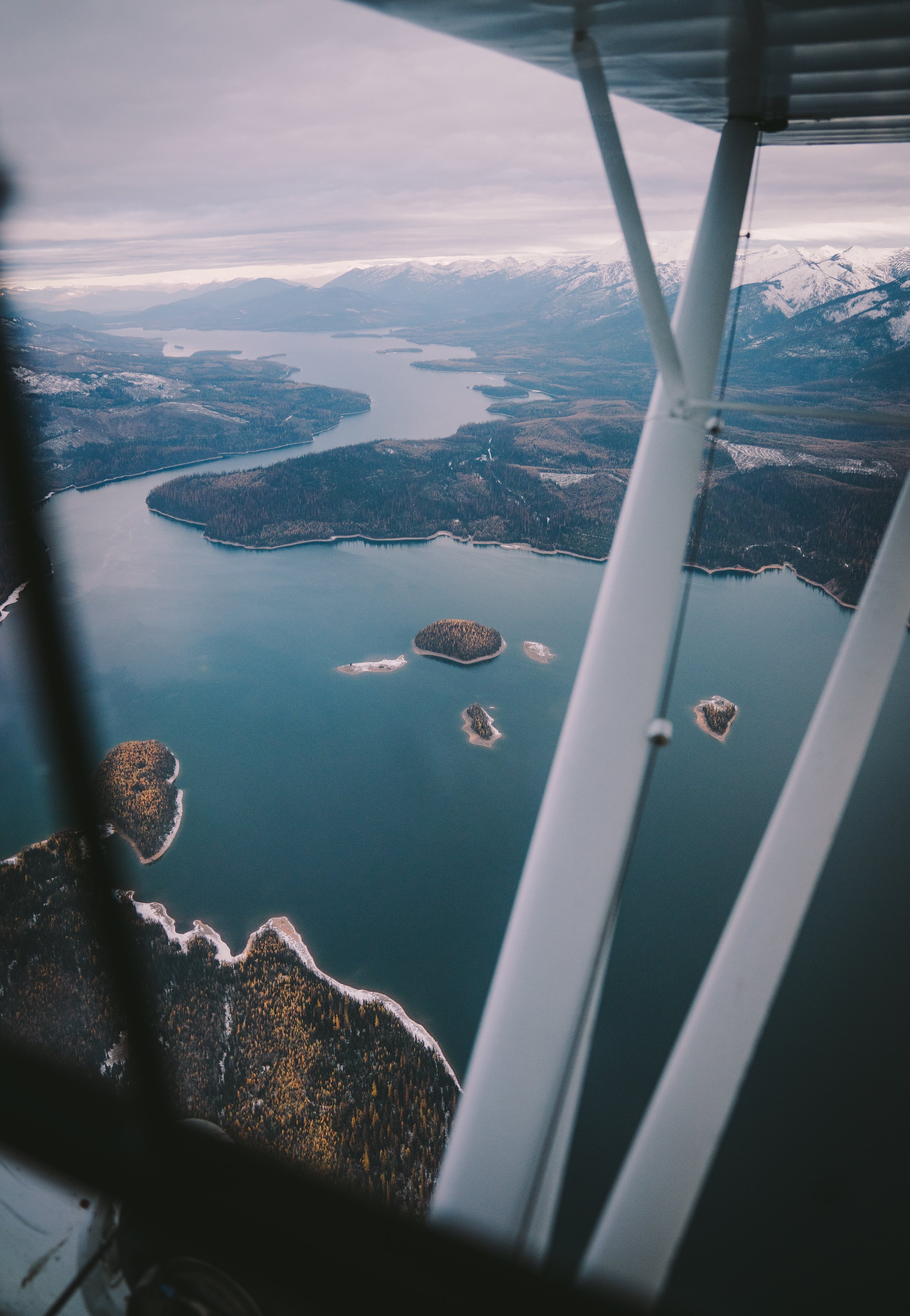 Aerial view of a body of water from the window of a small plane