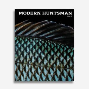 Vibrant close-up of a fish's detailed scales and fin on the cover of Modern Huntsman magazine, highlighting sustainable hunting, nature, and outdoor lifestyle themes with artistic photography.