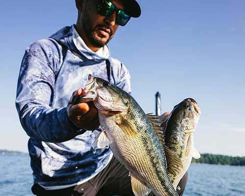 Man catching fish with sunglasses on